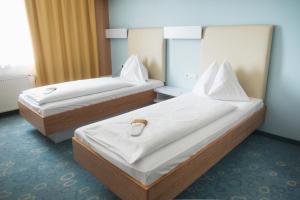 Katil atau katil-katil dalam bilik di Dom-Hotel