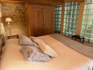 Postel nebo postele na pokoji v ubytování LE PETIT CLOS