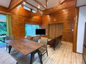 a dining room with a table and chairs at コテージ33 in Nasu