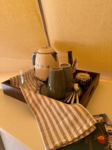 a kitchen counter with a coffee maker on a tray at Söderlångvik Glamping in Söderlångvik