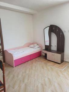 Postel nebo postele na pokoji v ubytování Jordanovi Apartment