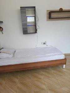 Postel nebo postele na pokoji v ubytování Jordanovi Apartment