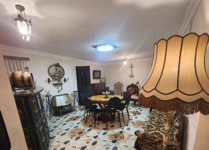 a dining room with a table and chairs in a room at Hotel Nike in Tsalka