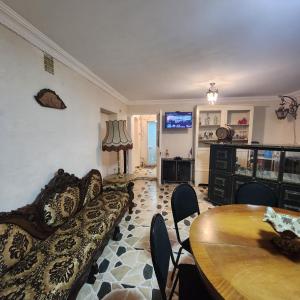 a living room with a couch and a table at Hotel Nike in Tsalka
