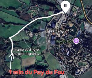 a map of a park with a white arrow at Au Petit Bignon in Les Épesses