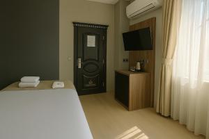 A bed or beds in a room at Monezza Avcılar