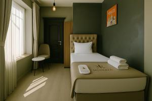 A bed or beds in a room at Monezza Avcılar
