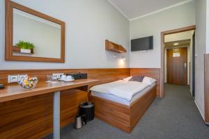 Ένα ή περισσότερα κρεβάτια σε δωμάτιο στο Hotel u Ledu