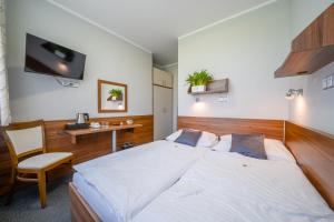 Ένα ή περισσότερα κρεβάτια σε δωμάτιο στο Hotel u Ledu