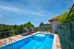 a swimming pool on the balcony of a house at villa MAK in Balchik