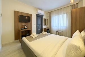 A bed or beds in a room at Monezza Avcılar