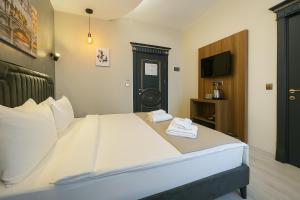 A bed or beds in a room at Monezza Avcılar