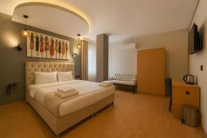 A bed or beds in a room at Monezza Avcılar