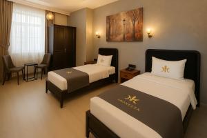 A bed or beds in a room at Monezza Avcılar