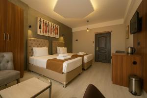 A bed or beds in a room at Monezza Avcılar