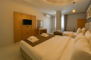 A bed or beds in a room at Monezza Avcılar
