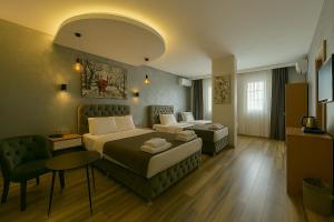 A bed or beds in a room at Monezza Avcılar