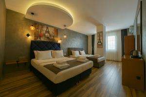 A bed or beds in a room at Monezza Avcılar