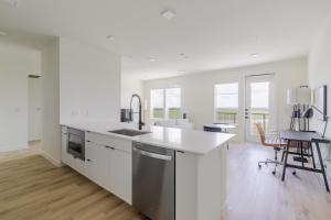 a white kitchen with a sink and a counter at Blueground Round Rock pool nr Old Settlers Park ATX-327 in Austin