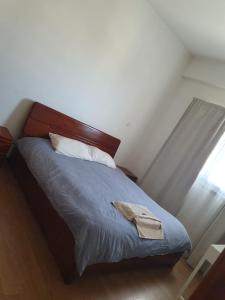 a bedroom with a bed with a blue comforter at Fantastic sea views in Larnaka