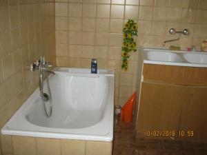 a shower in a bathroom with a sink and a tub at Pokój w centrum in Ustroń
