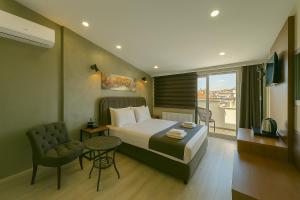 A bed or beds in a room at Monezza Avcılar