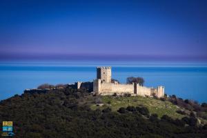 a castle on top of a hill in the ocean at Matinas House in Neos Panteleimonas