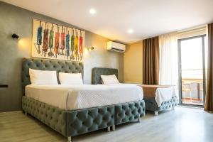 A bed or beds in a room at Monezza Avcılar