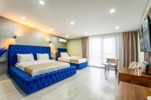 A bed or beds in a room at Monezza Avcılar
