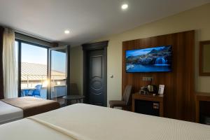 A bed or beds in a room at Monezza Avcılar