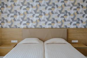 Кровать или кровати в номере Seasons Hotel (Adults Only)