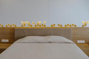 Кровать или кровати в номере Seasons Hotel (Adults Only)