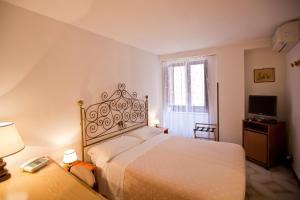 Postel nebo postele na pokoji v ubytování Hotel Moderno