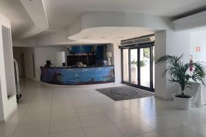 a large room with a large aquarium in the middle of it at Capo Skino Park Hotel in Gioiosa Marea