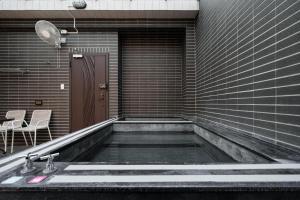 Kép 漫居包棟民宿- 有電梯, 電動車充電樁, 電動麻將, Switch szállásáról Tungsanban a galériában