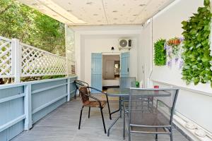 a balcony with a table and chairs on it at Hotel Selini in Agios Nikitas
