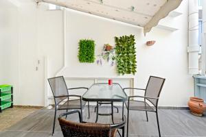 a dining room with a glass table and chairs at Hotel Selini in Agios Nikitas