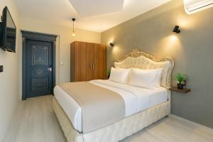 A bed or beds in a room at Monezza Avcılar