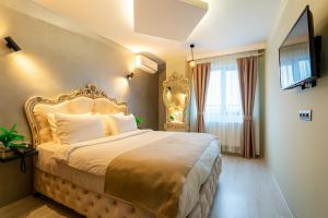 A bed or beds in a room at Monezza Avcılar