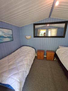 Postel nebo postele na pokoji v ubytování Tottes Resort