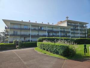 a large building with bushes in front of it at studio, Anglet Chiberta ocean golf surf in Anglet