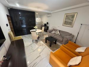 a living room with a couch and a table at Central in Dubrovnik