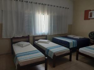 Postel nebo postele na pokoji v ubytování Hotel JF2