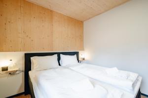 Postel nebo postele na pokoji v ubytování Clofers Relax Residences Rattendorf