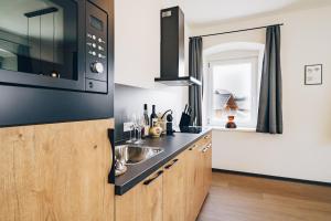 Kuchyň nebo kuchyňský kout v ubytování Clofers Relax Residences Rattendorf