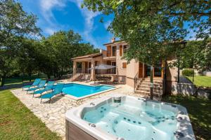 a pool in the backyard of a house at Villa Anteva in Poreč