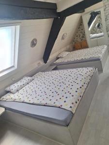 a bedroom with two bunk beds in a attic at Pension "Brückenschänke" in Nassau