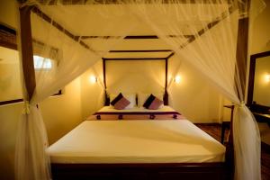 Katil atau katil-katil dalam bilik di Ashwin Ayurveda Villa