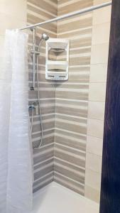 a shower in a bathroom with a shower at Home from home at the Seacrest in St Paul's Bay