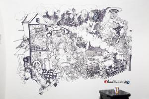 a drawing of a collage of objects on a wall at Hostel Il Nosadillo - Bologna in Bologna +23 photos